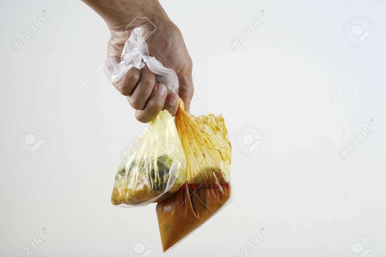 117603587-holding-a-curry-in-plastic-bag.jpg