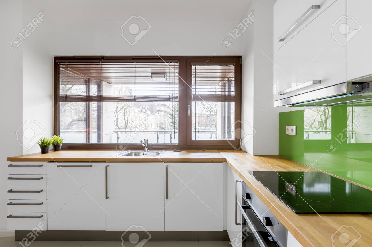 white kitchen cabinets with green backsplash gallery of light