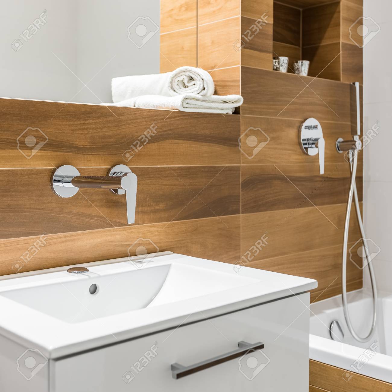 White Cabinet Basin With Drawer In Beautiful Wooden Bathroom Stock