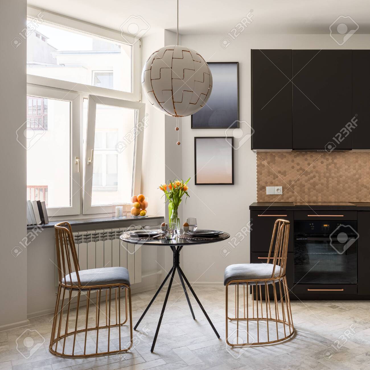Stylish Black Dining Table And Two Modern Copper Chairs Under Stock Photo Picture And Royalty Free Image Image 155711983