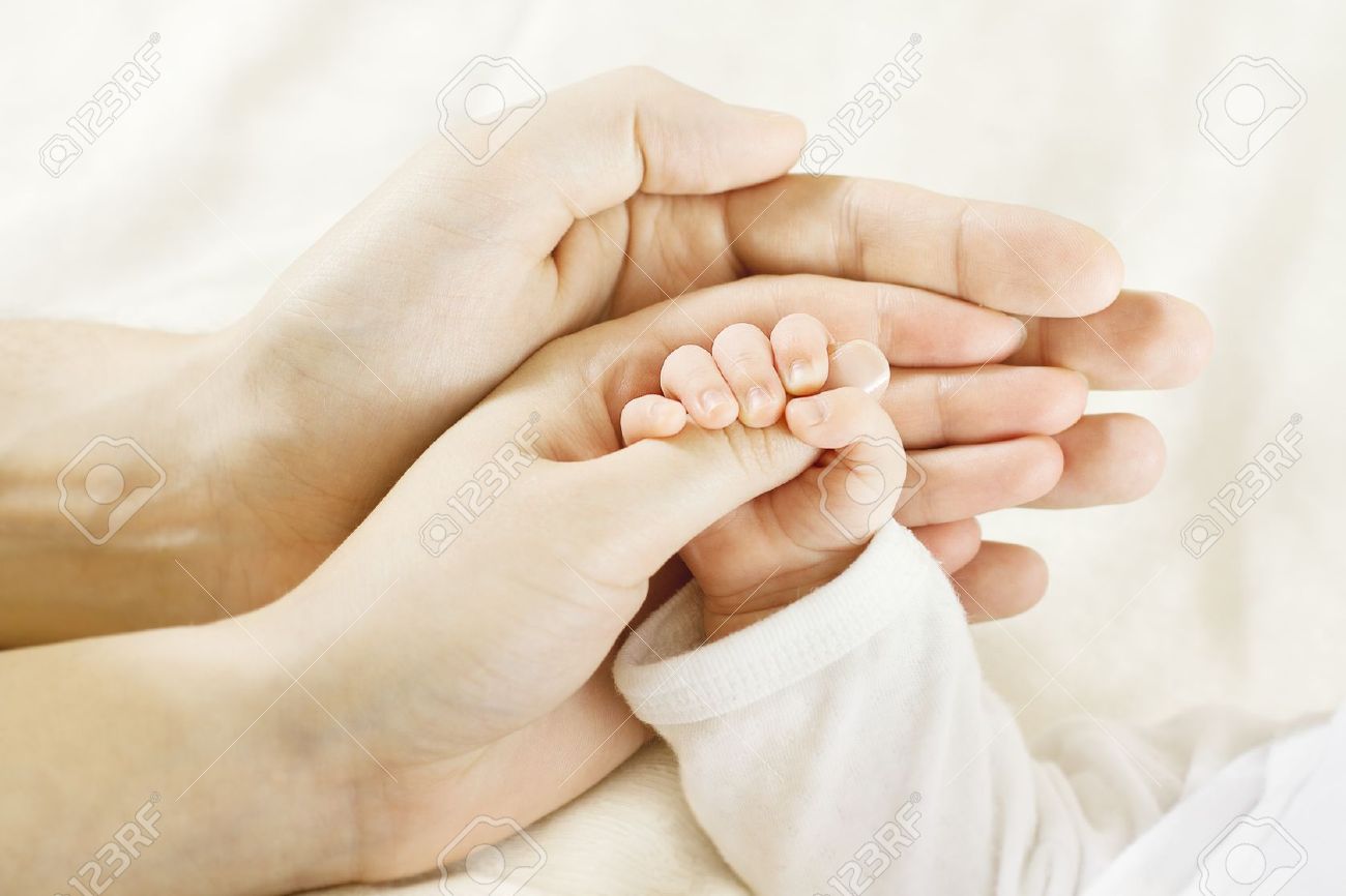Closeup Of Baby Hand Into Parents Hands. Family Concept Фотография,  картинки, изображения и сток-фотография без роялти. Image 12374467