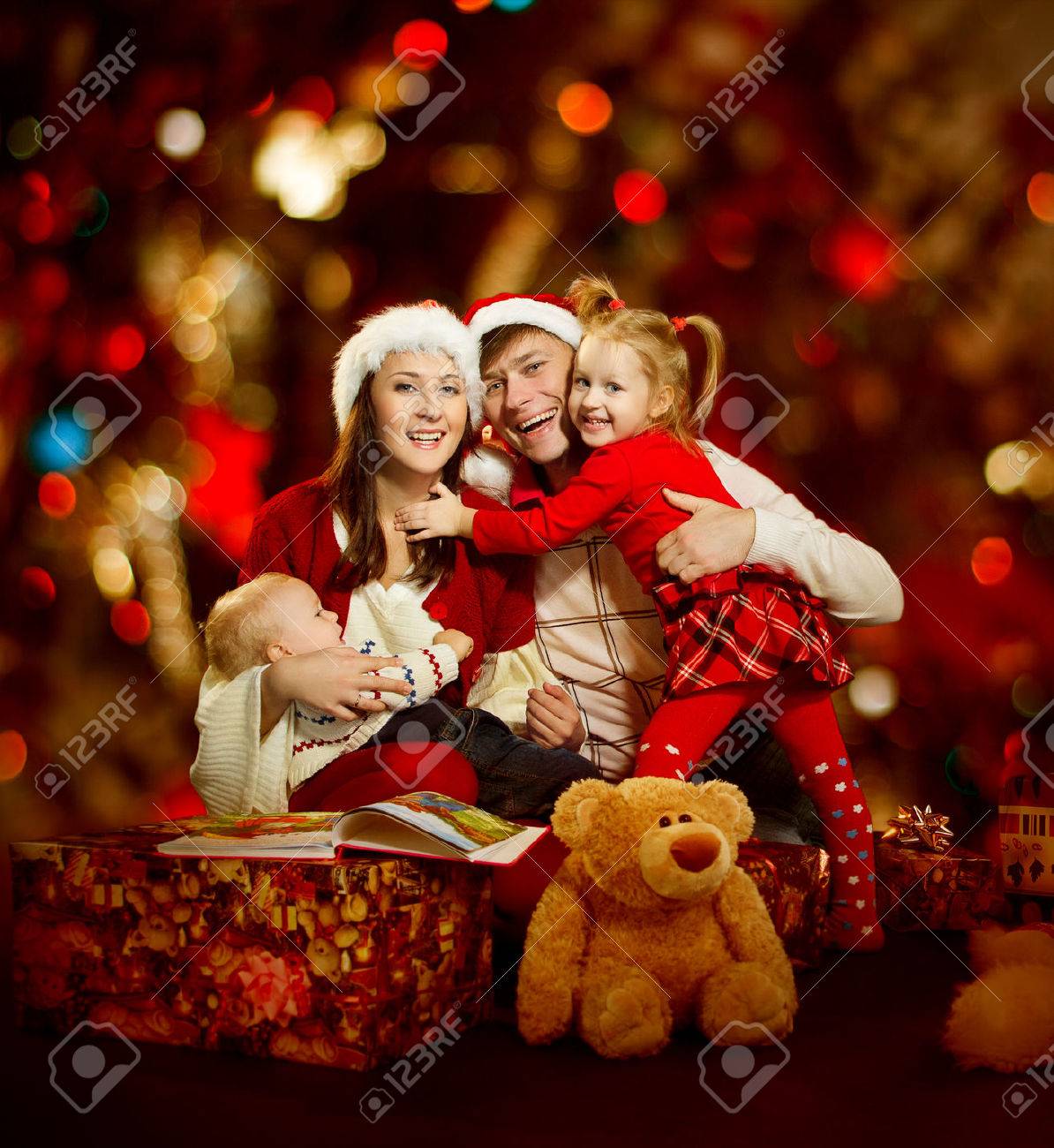 christmas family of four persons happy smiling stock photo picture