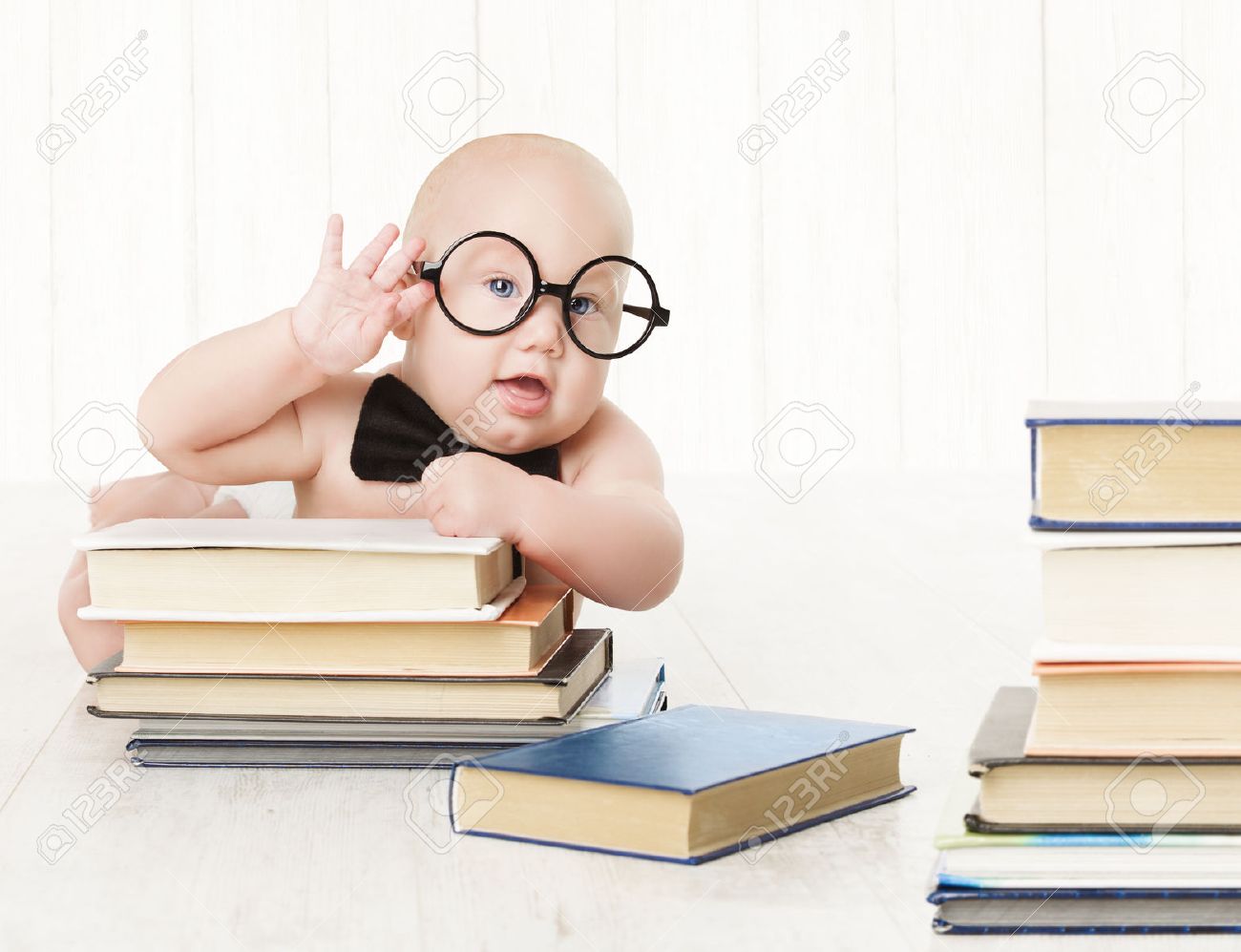 Baby In Glasses And Books Kids Early Childhood Education And Development Smart Child Preschool Reading Concept Over White Background Stock Photo Picture And Royalty Free Image Image