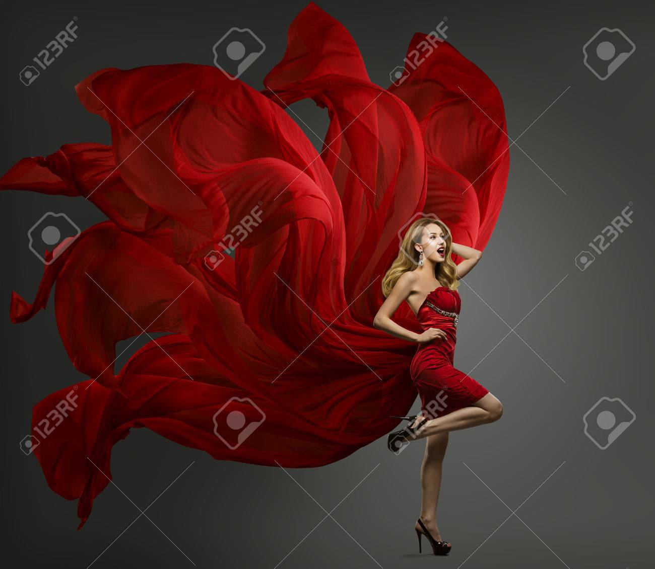 Fashion Model Red Dress, Woman Dancing in Flying Fabric Gown, Waving Fluttering Cloth - 68915132 Fashion Model Red Dress, Woman Dancing in Flying Fabric Gown, Waving Fluttering Cloth - 68915132