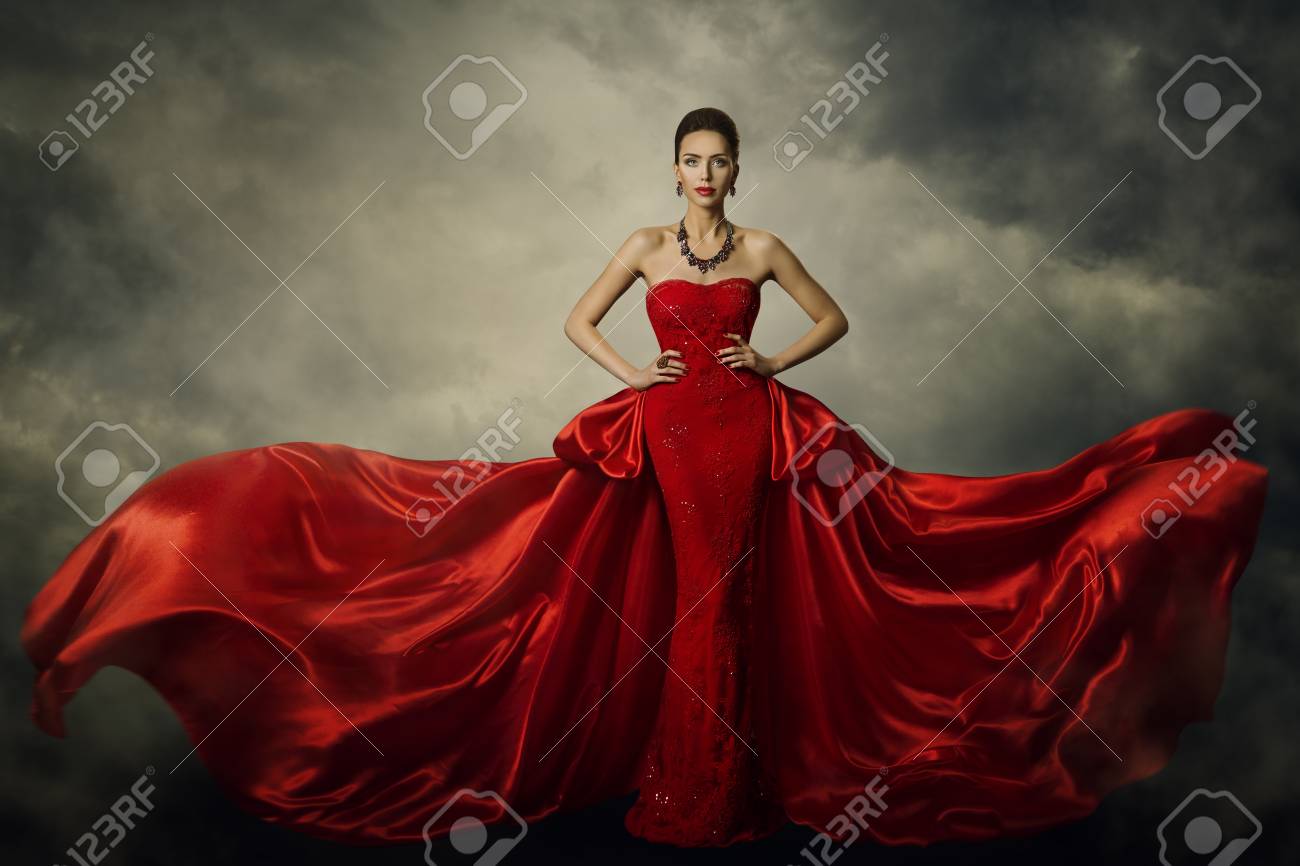 Fashion Model Art Dress, Elegant Woman Standing in Red Retro Gown, Silk Fabric Fluttering over Storm Sky Background - 90693375 Fashion Model Art Dress, Elegant Woman Standing in Red Retro Gown, Silk Fabric Fluttering over Storm Sky Background - 90693375