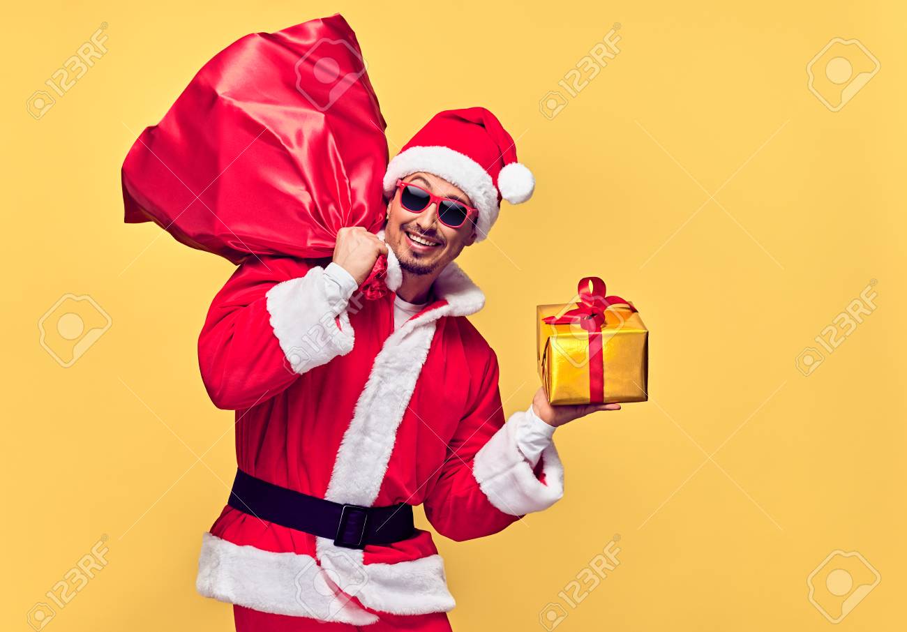 Santa Claus. Young Happy Santa Man. Christmas Santa sack bag..