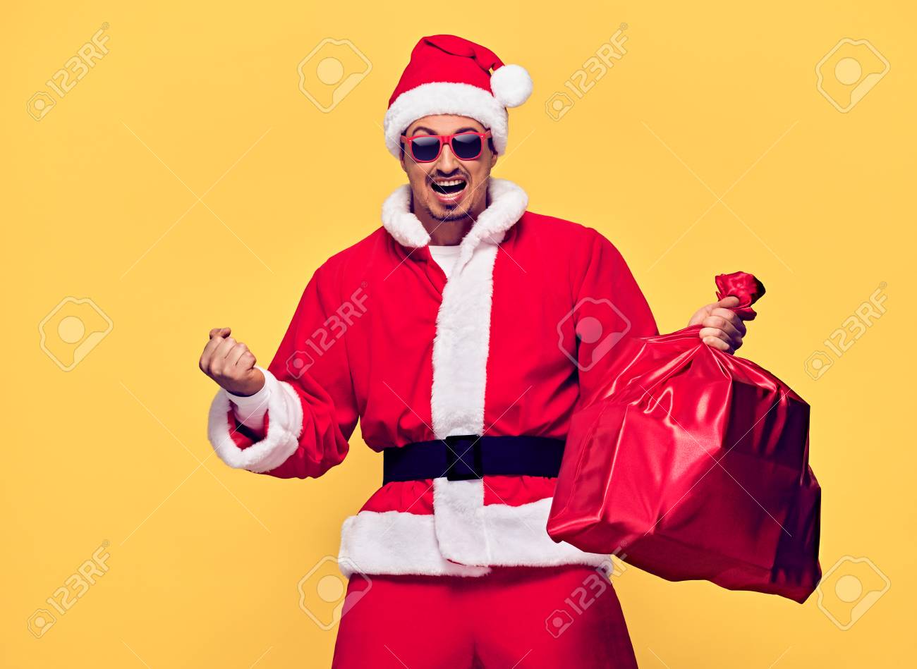 Santa Claus. Young Happy Santa Man Winner Gesture. Handsome Fashion..