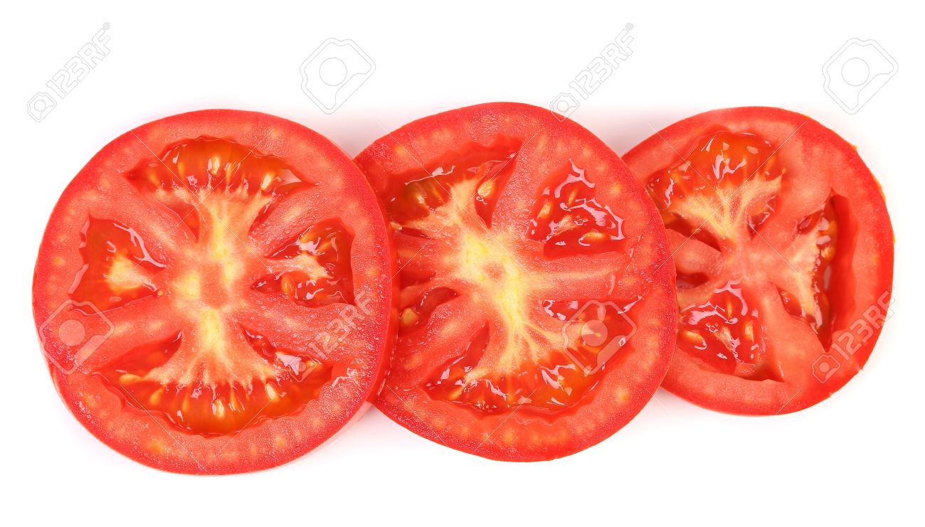 tomato slice isolated on white background close up stock photo