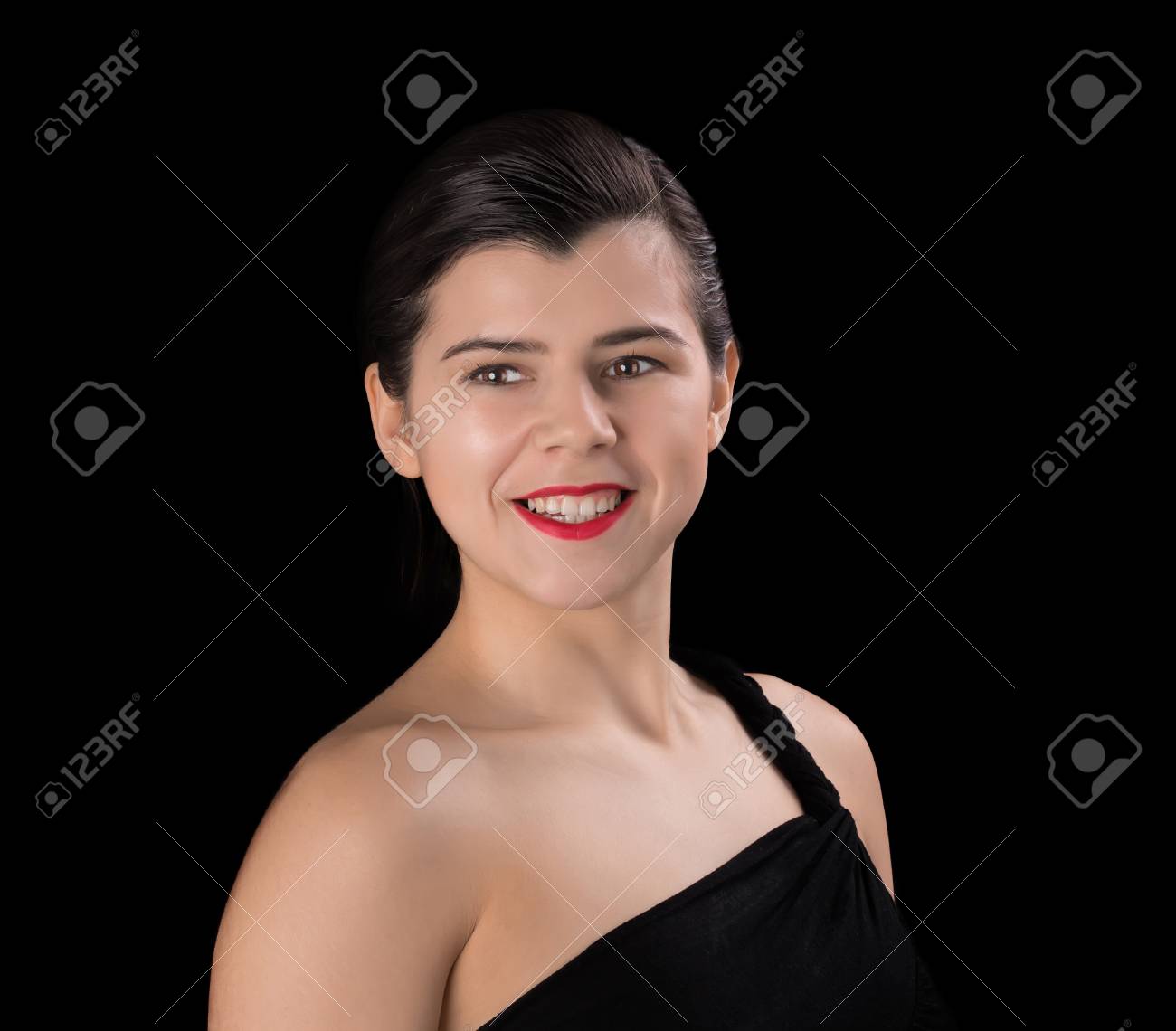 Smiling Brunette Woman In Black Dress With A Short Haircut And