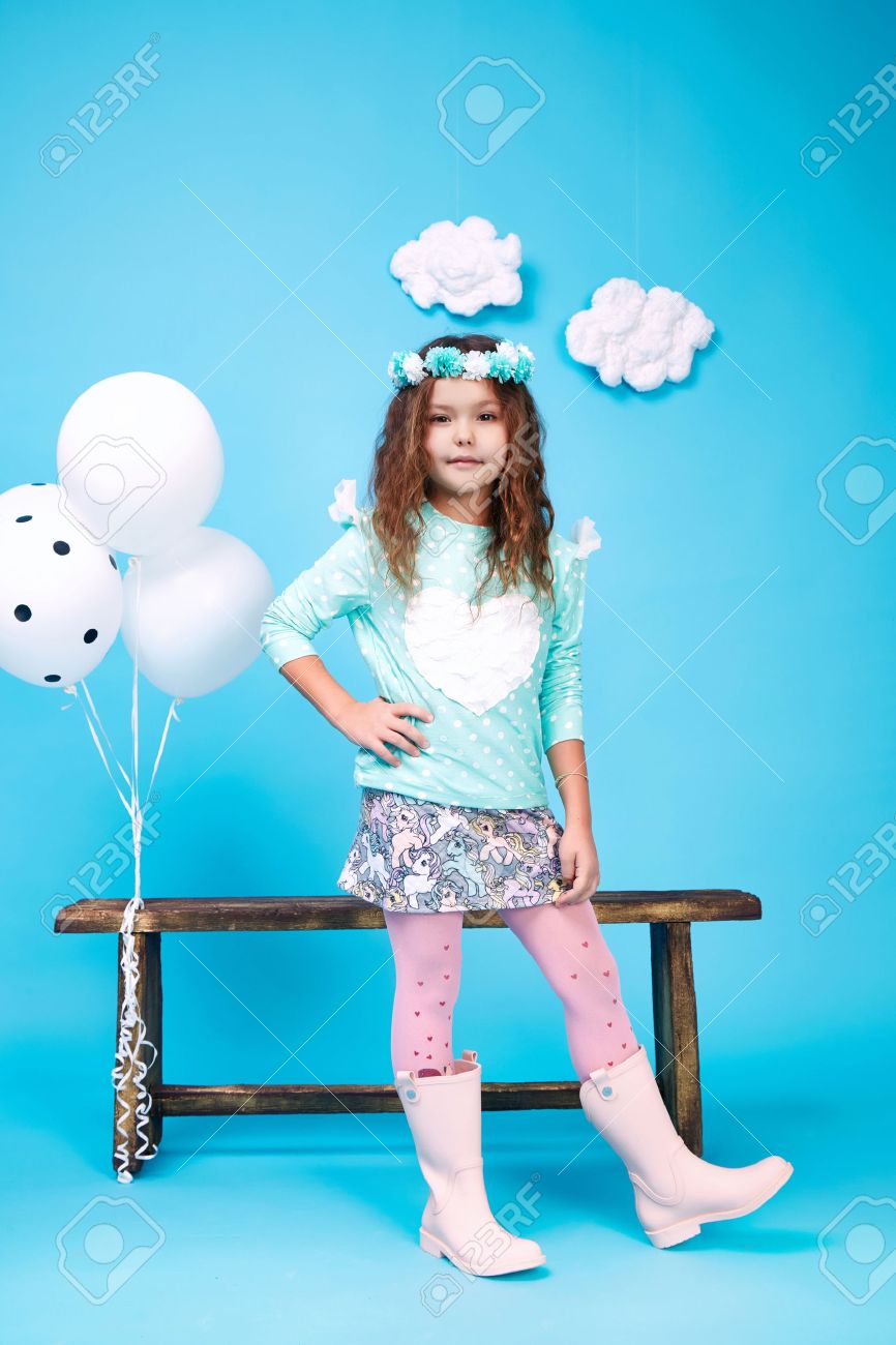 Small little beautiful pretty cute girl dark hair hat with flowers wear fashion style trend clothing dress skirt blouse shoe smile play with bench and balloons dance jump children kid happy daughter - 54432866 Small little beautiful pretty cute girl dark hair hat with flowers wear fashion style trend clothing dress skirt blouse shoe smile play with bench and balloons dance jump children kid happy daughter - 54432866