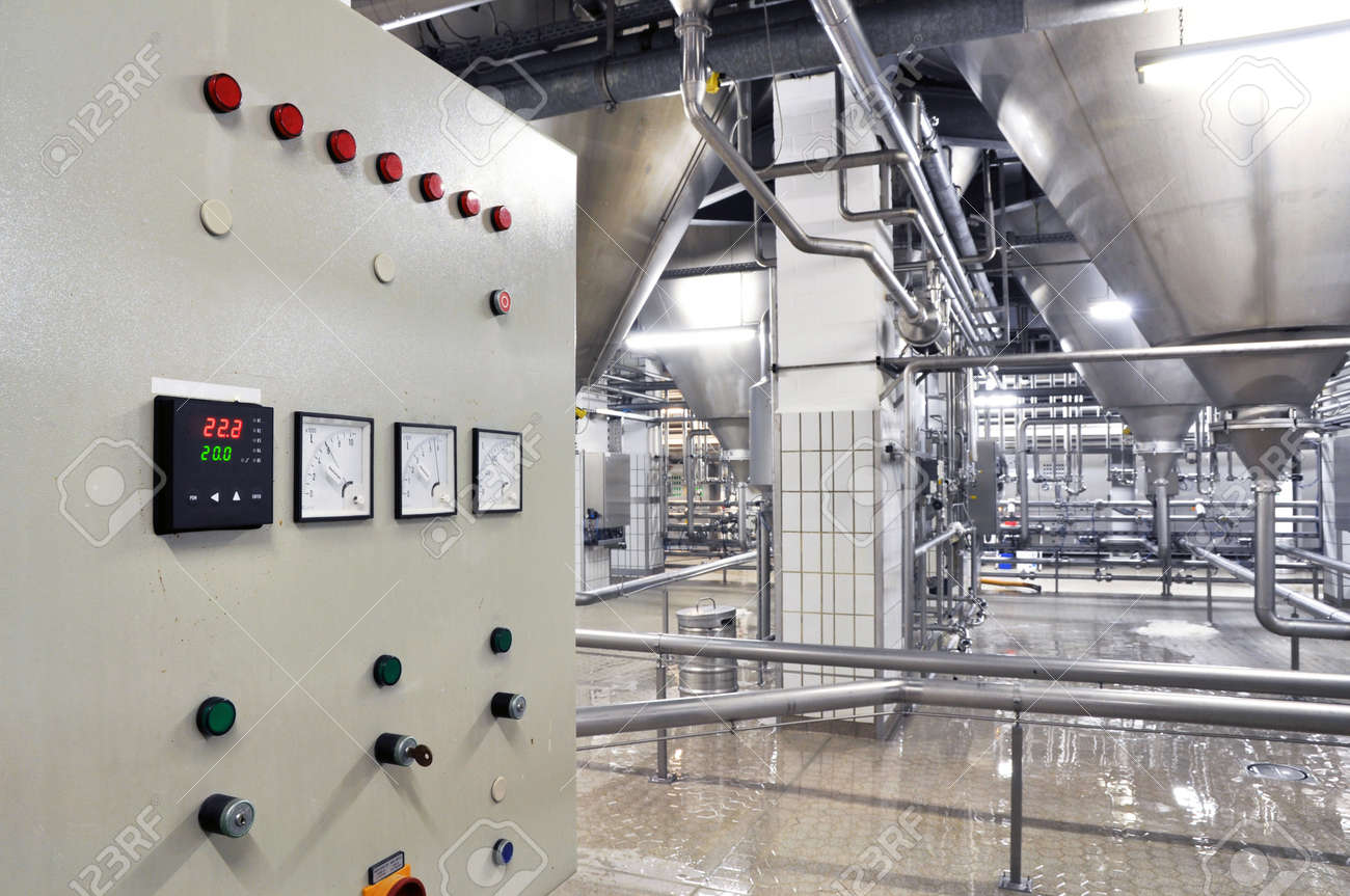 Industrial plant in a modern brewery - technology in a factory building with pipes and fittings - 169627484 Industrial plant in a modern brewery - technology in a factory building with pipes and fittings - 169627484