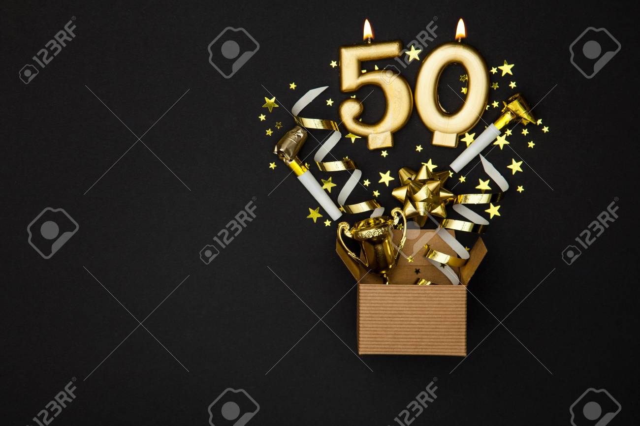 Number 50 gold celebration candle and gift box background - 91935377 Number 50 gold celebration candle and gift box background - 91935377