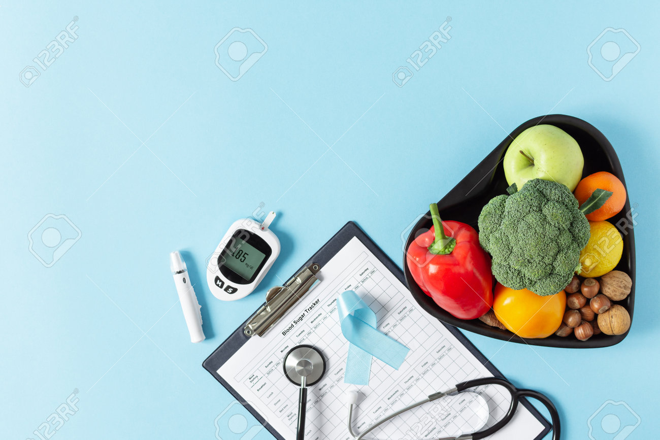 Fresh vegetables and fruit with glucometer top view on blue background. Diabetic dieting concept. - 162813140 Fresh vegetables and fruit with glucometer top view on blue background. Diabetic dieting concept. - 162813140