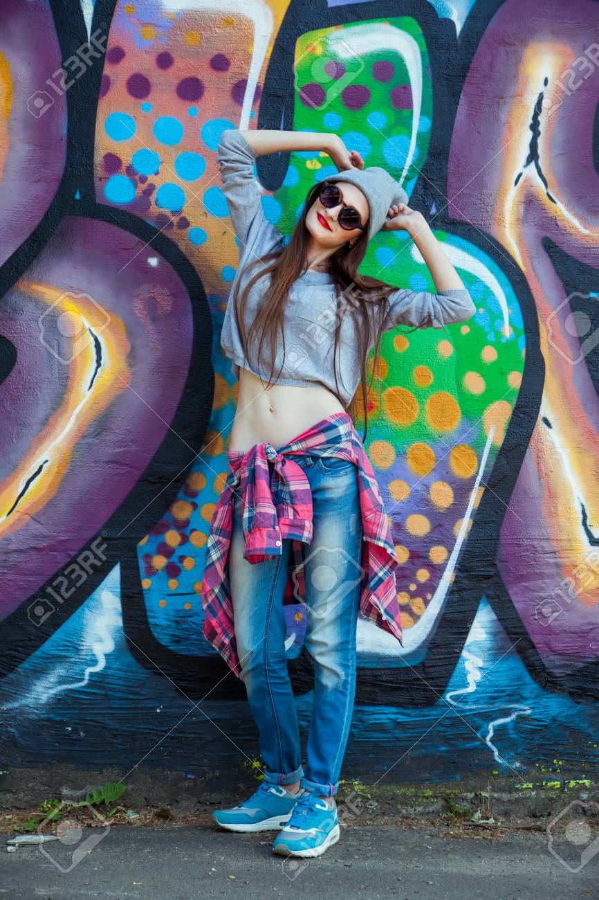 Trendy Beautiful Long Haired Young Model In Hat Posing On Graffiti Stock Photo Picture And Royalty Free Image Image 41976997