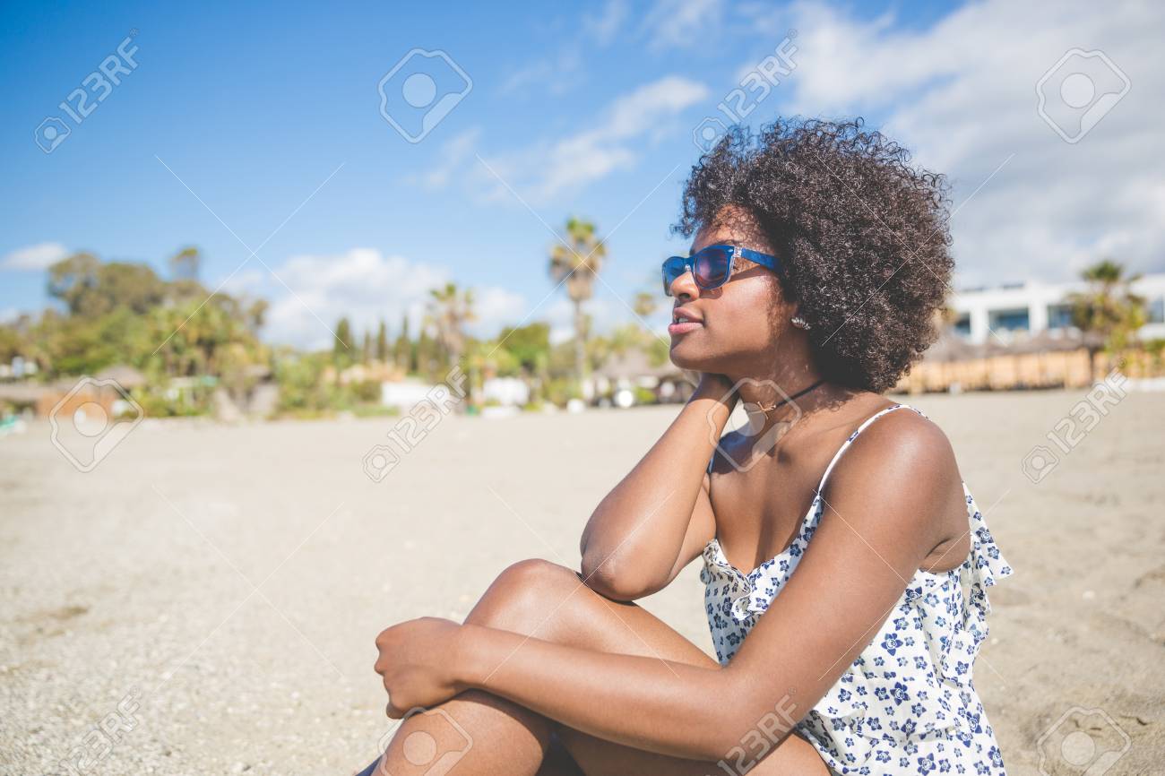pretty afro american woman relaxing on beach stock photo picture