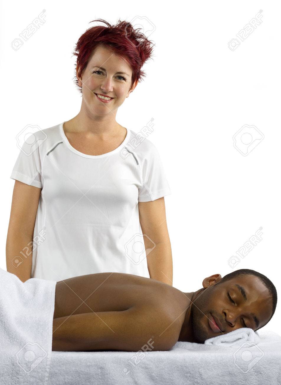 Young Female Masseuse Treating Young Male Client With Massage Stock Photo Picture And Royalty Free Image Image