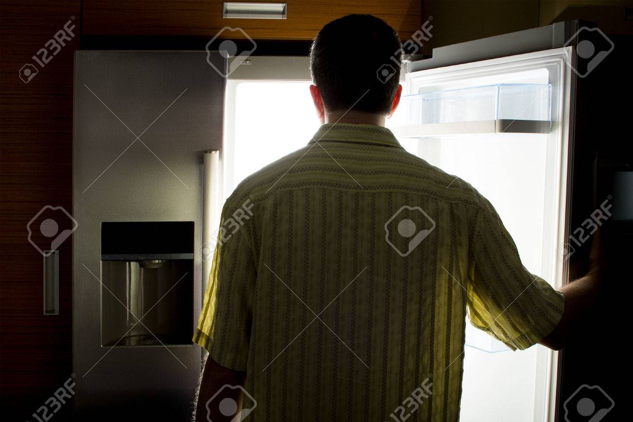 Man Looking For Food In An Open Fridge In A Dark Kitchen Late At Night  Stock Photo, Picture and Royalty Free Image. Image 59220226., image size:1300x866