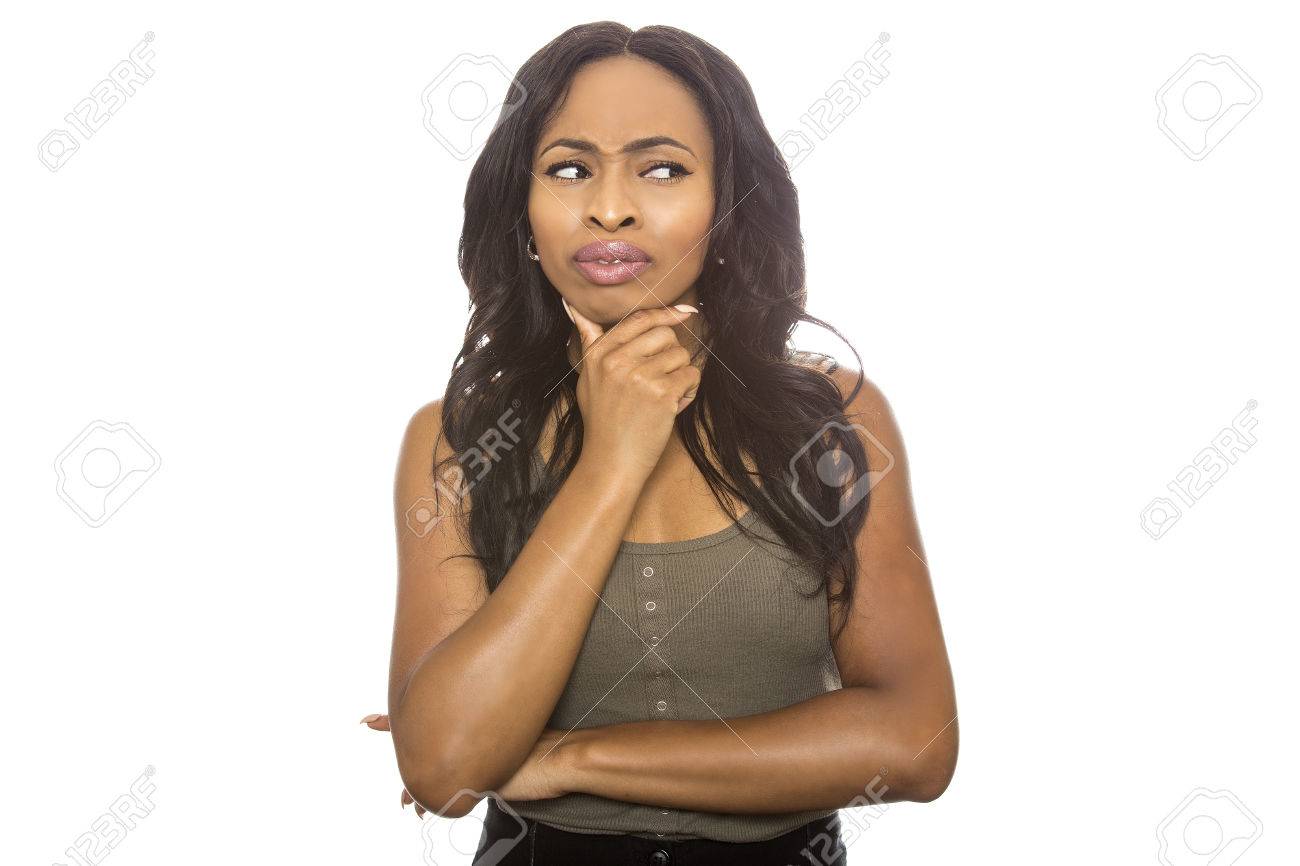 Black female isolated on a white background displaying facial confused expressions. She is young and of African American ethnicity. - 85349669 Black female isolated on a white background displaying facial confused expressions. She is young and of African American ethnicity. - 85349669