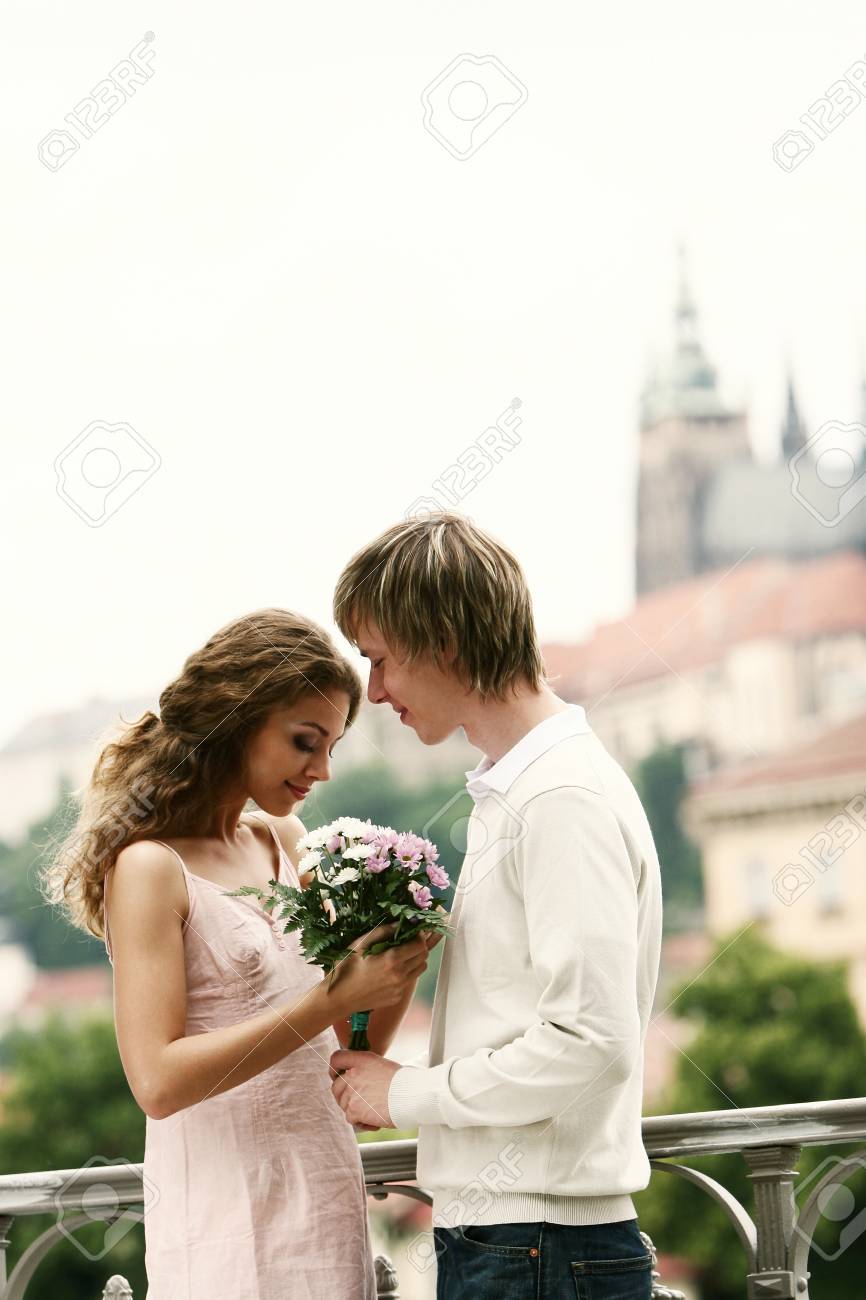 guy giving girl flowers