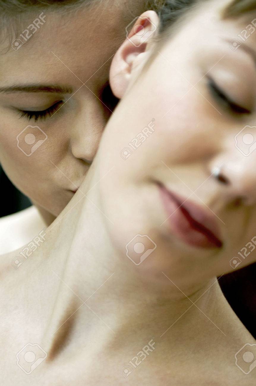 A Woman Kissing Her Partner's Neck Stock Photo, Picture and Royalty Free  Image. Image 26382245.