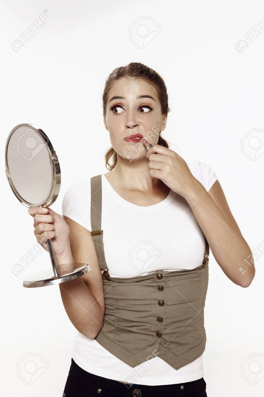 woman holding hand mirror heart shaped hand stock photo woman holding hand mirror while applying lipstick holding hand mirror while applying lipstick woman holding hand mirror heart shaped hand stock photo woman holding hand mirror while applying lipstick holding hand mirror while applying lipstick