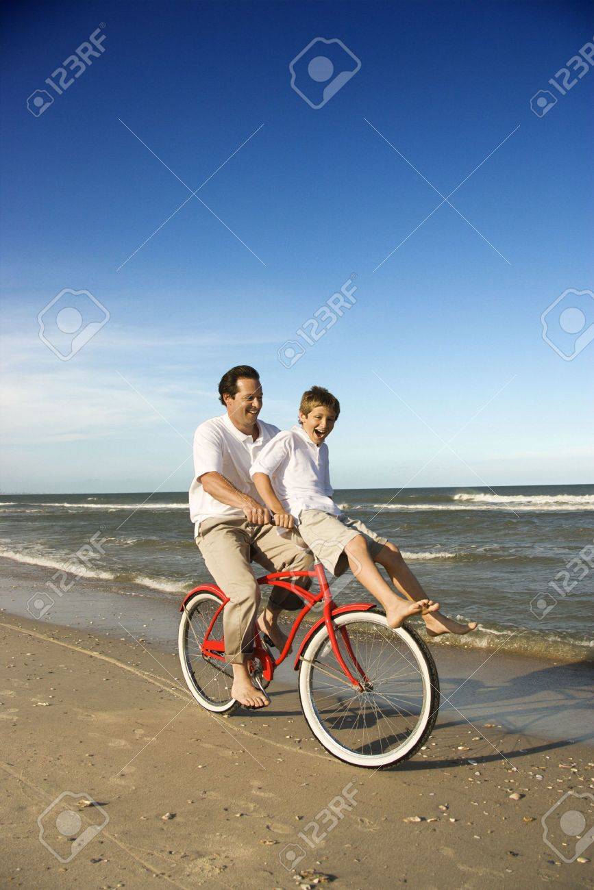 riding on the handlebars of a bike