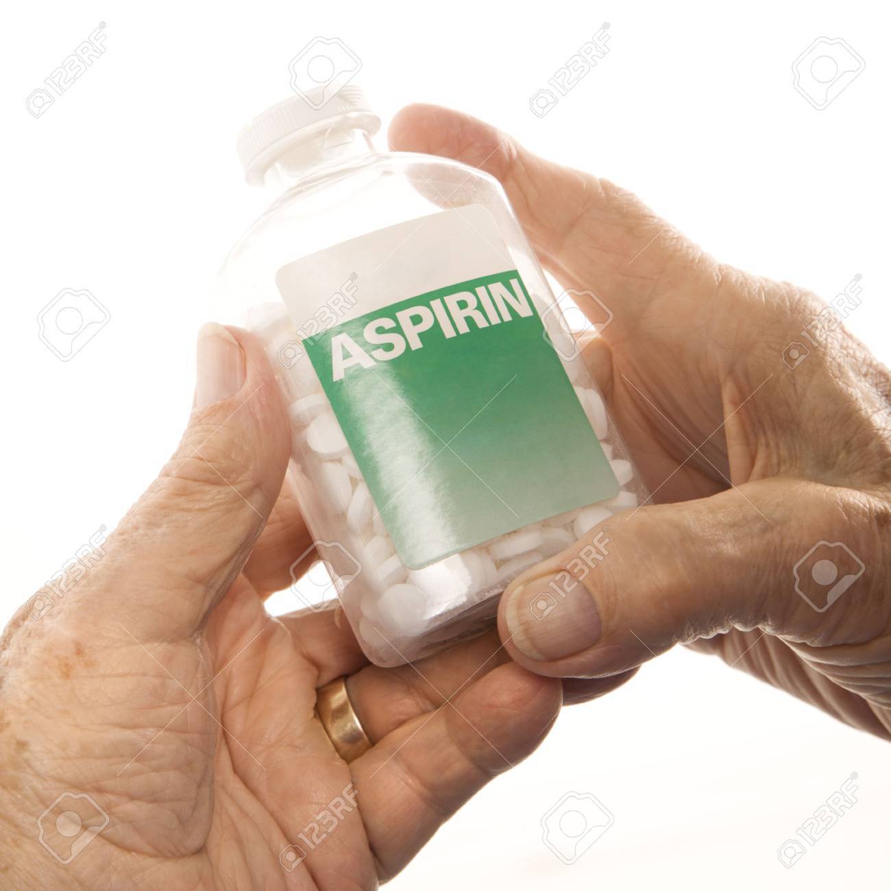 Close-up of elderly male Caucasion hands holding aspirin bottle. - 2246016 Close-up of elderly male Caucasion hands holding aspirin bottle. - 2246016