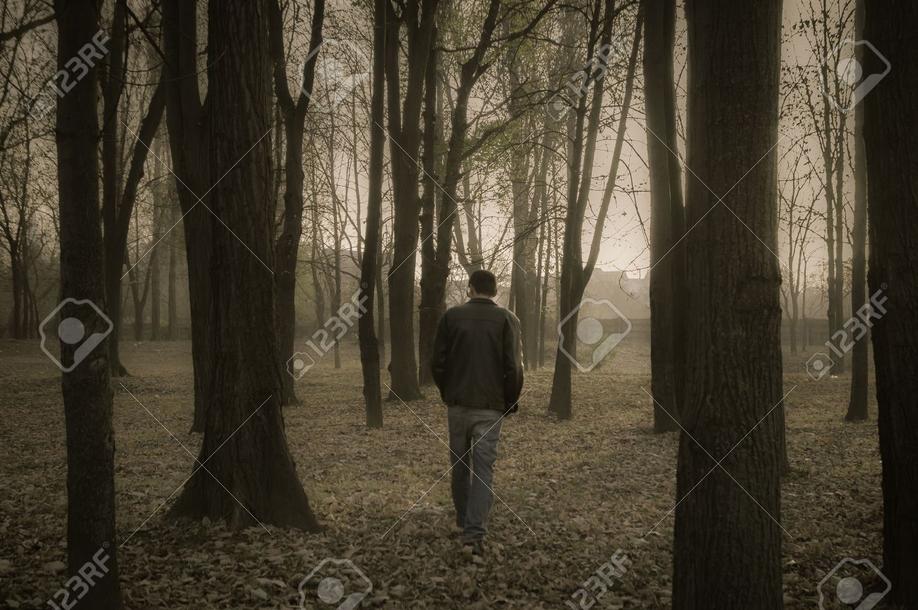 Sad Lonely Man Walking Through The Forest Stock Photo Picture And Royalty Free Image Image