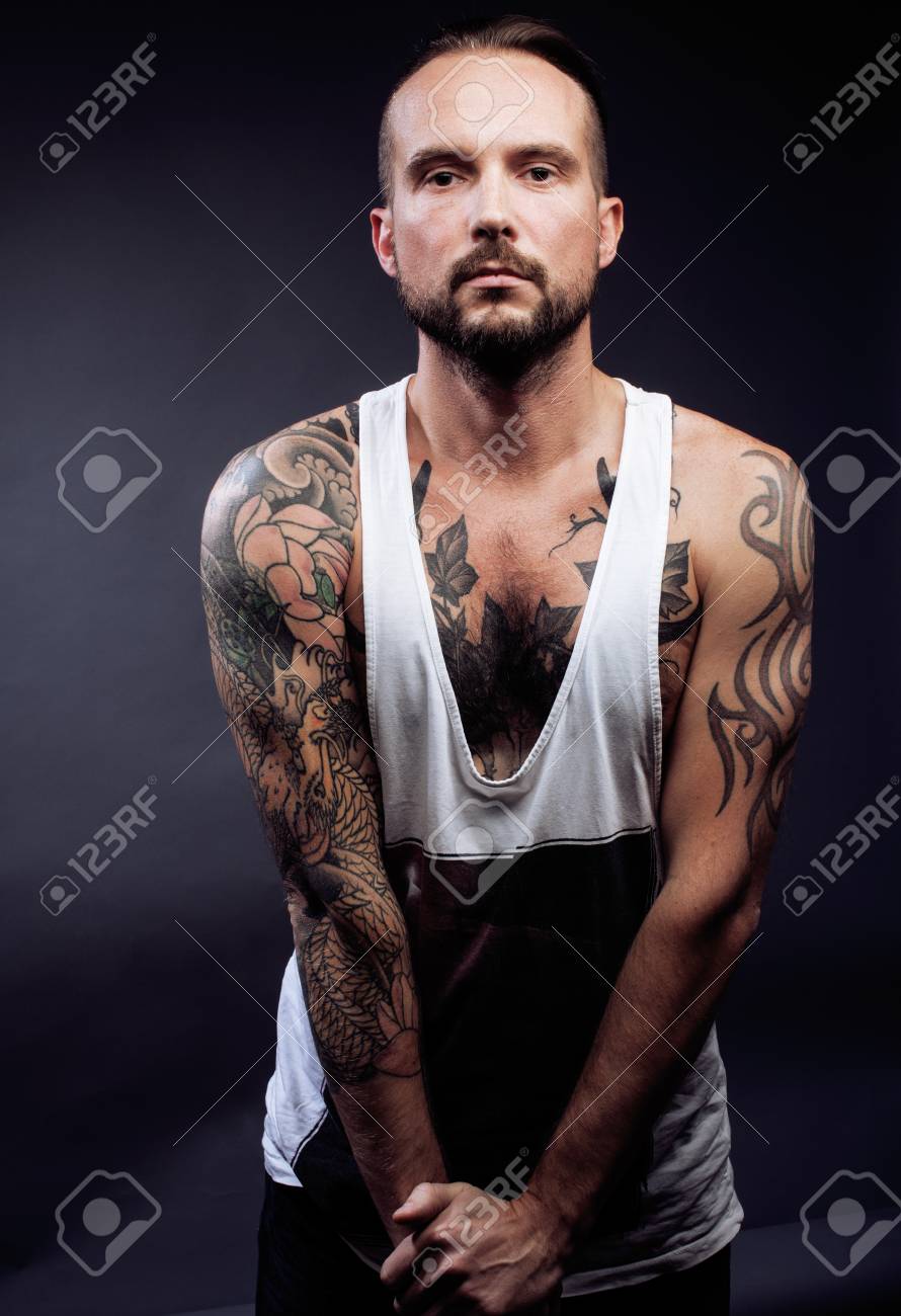 A Man With Tattooes On His Arms Silhouette Of Muscular Body