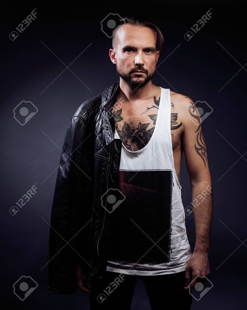 A Man With Tattooes On His Arms Silhouette Of Muscular Body