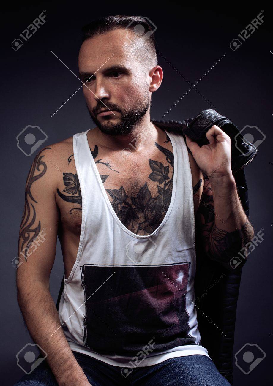 A Man With Tattooes On His Arms Silhouette Of Muscular Body