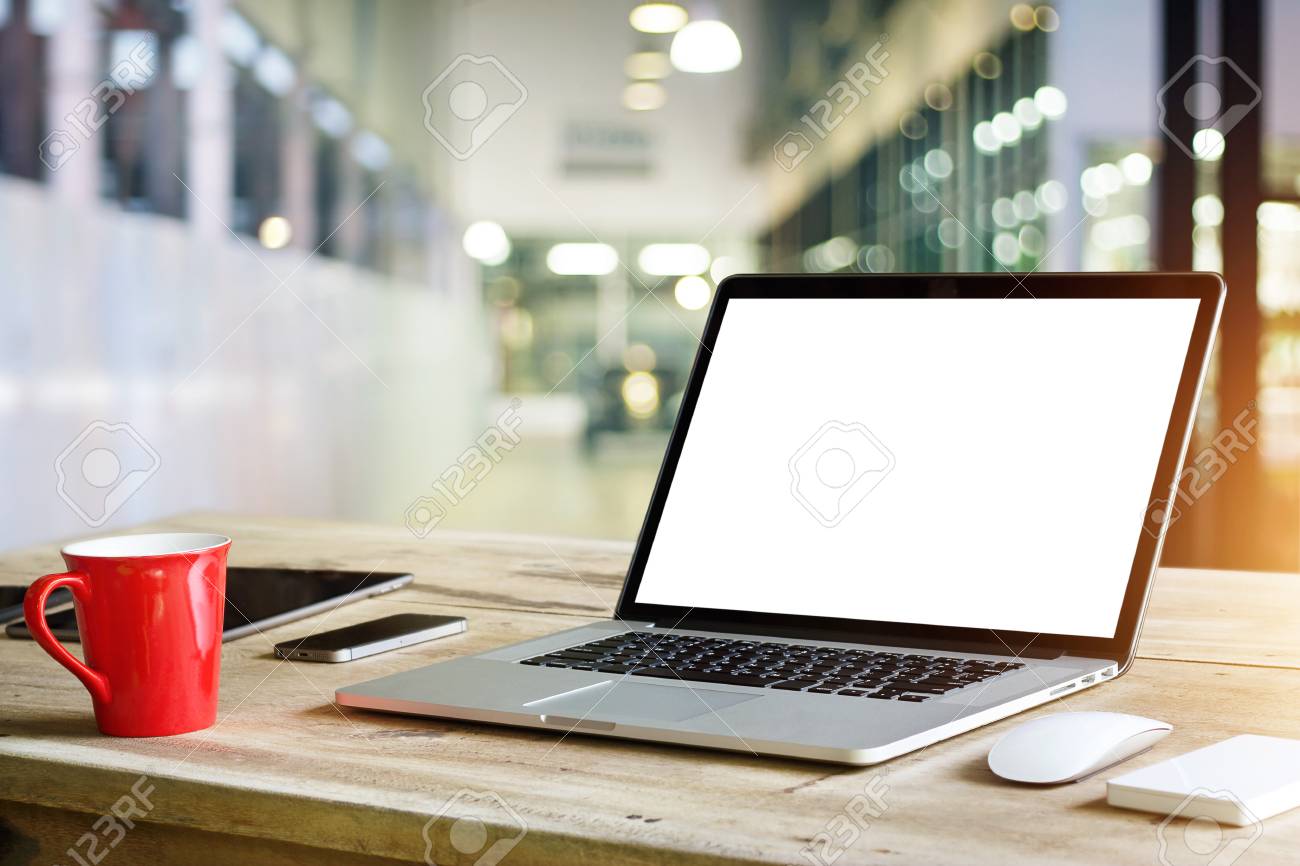 Laptop With Blank White Screen On Table In Office Background Stock Photo,  Picture And Royalty Free Image. Image 90186810.