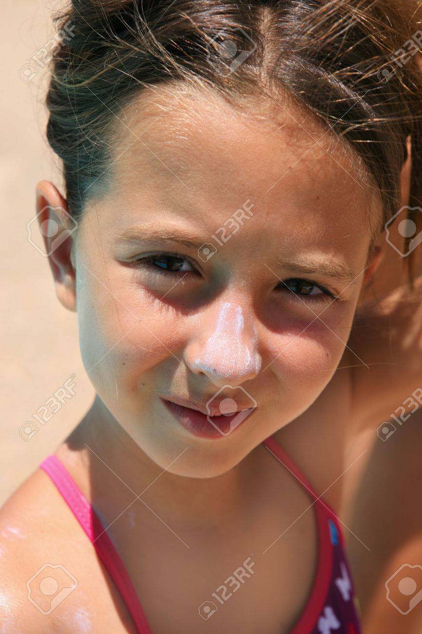 Cute Girl Sunbathing With Sunscreen In Her Nouse At The Beach Stock Photo Picture And Royalty Free Image Image 1265