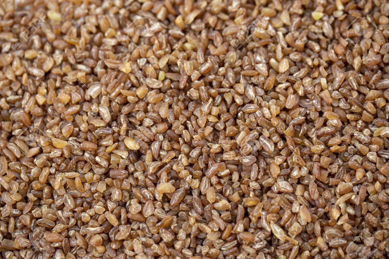 Raw Bulgur Wheat Background Texture. Top View Stock Photo, Picture and  Royalty Free Image. Image 147910542.