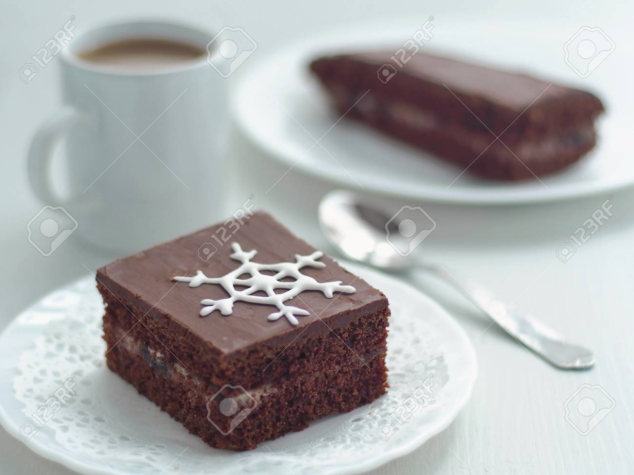 Square Piece Of Homemade Chocolate Cake Decorated With Sugar