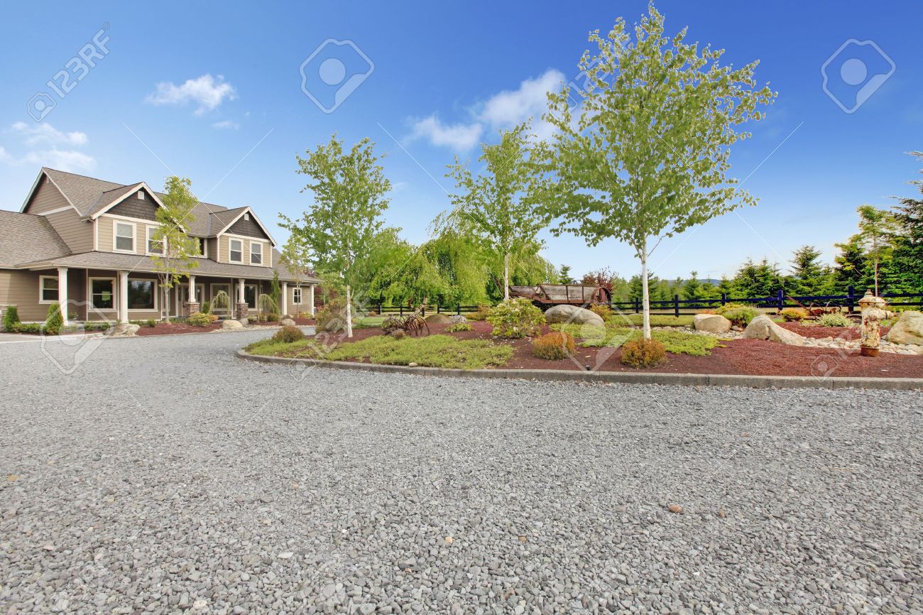 Large farm country house with gravel driveway and green landscape. - 17848846 Large farm country house with gravel driveway and green landscape. - 17848846