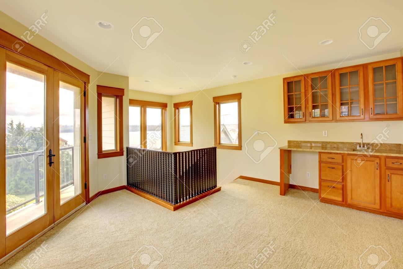 empty large room with wood cabinets new luxury home interior stock