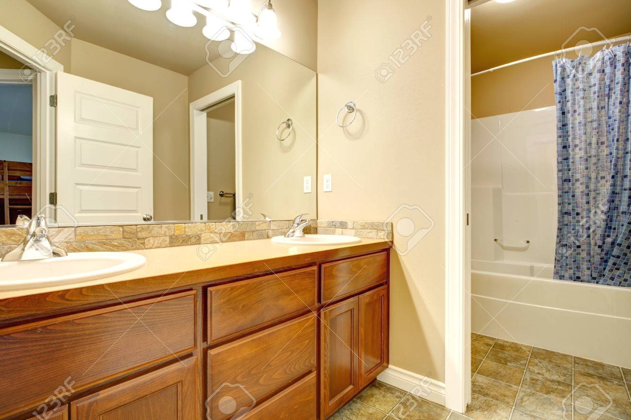 Bathroom Interior Viw Of Wooden Washbasin Cabinets With Mirror