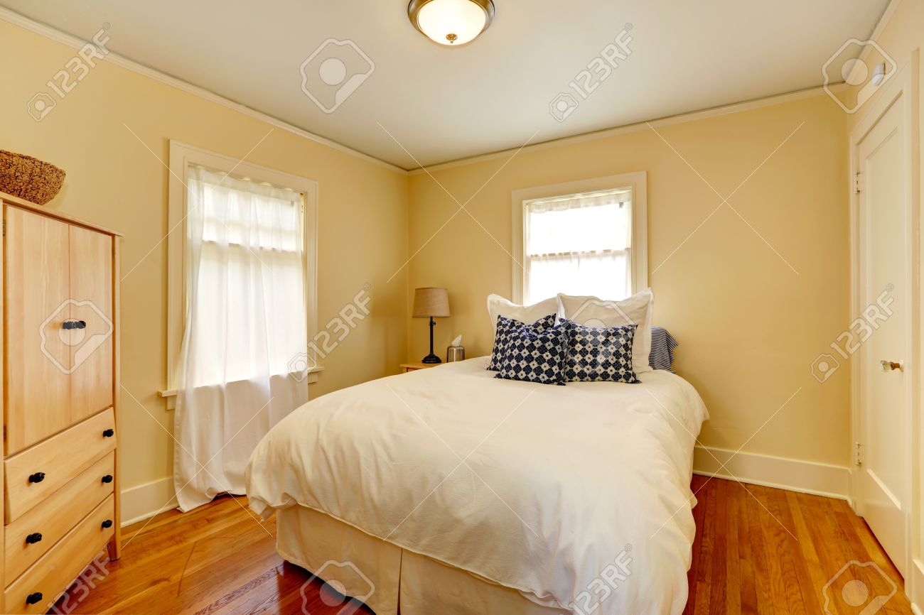 small bedroom with two windows