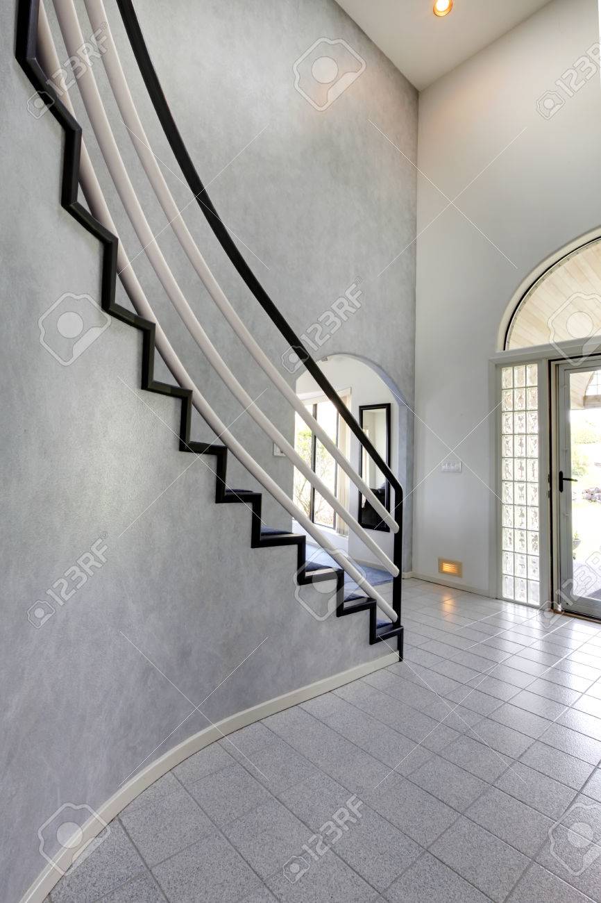 Modern Foyer With High Ceiling And Tile Floor View Of Steep