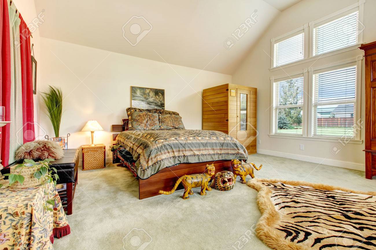 Tropical Bedroom With High Vaulted Ceiling Decorated With Tiger