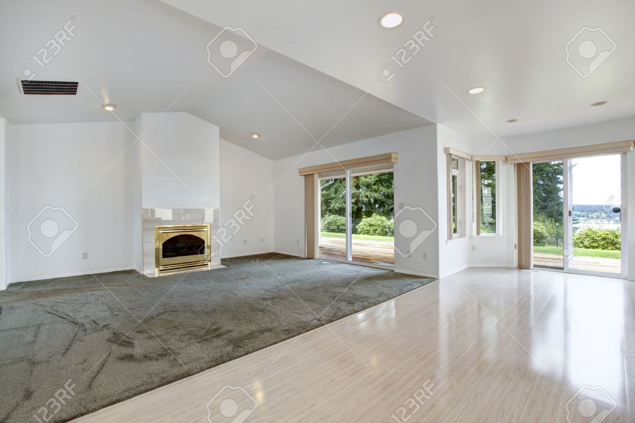 house open floor plan.. bright empty living room with fireplace house open floor plan.. bright empty living room with fireplace