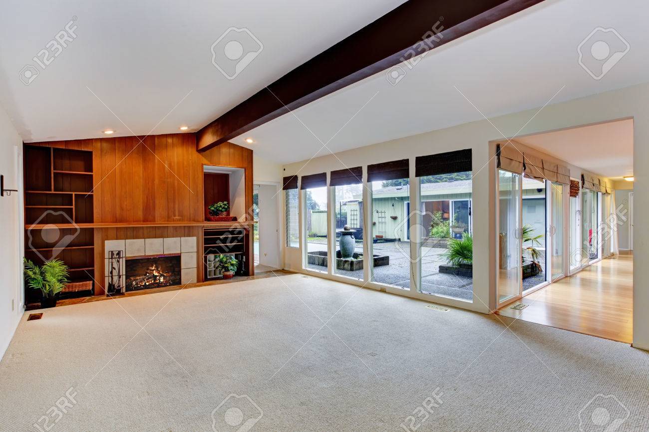 Spacious Empty Living Room With Vaulted Ceiling With Beam Built