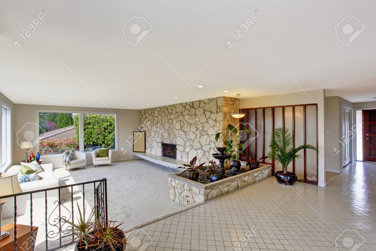 Bright Living Room With Fountain In Luxury House. View Of Entrance ... Bright Living Room With Fountain In Luxury House. View Of Entrance ...