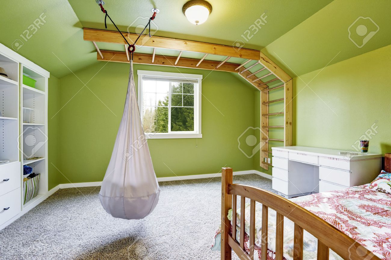 Kids Room Interior In Bright Green With Attached Ladder To The Kids Room Interior In Bright Green With Attached Ladder To The Wall And Hanging Chair Stock