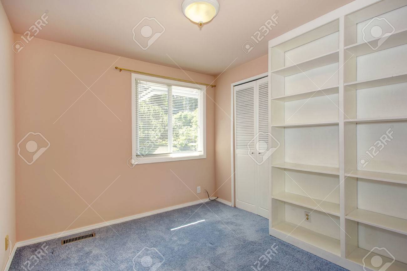 Empty Room Interior In Soft Peach Color With Light Blue Carpet