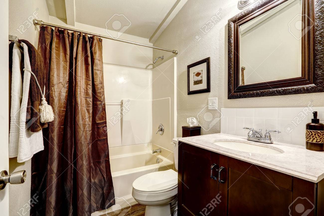 White And Brown Bathroom Interior With Brown Curtain And Brown Stock Photo Picture And Royalty Free Image Image 30971348