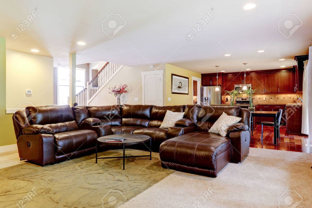house interior with open floor plan. living room with leather house interior with open floor plan. living room with leather