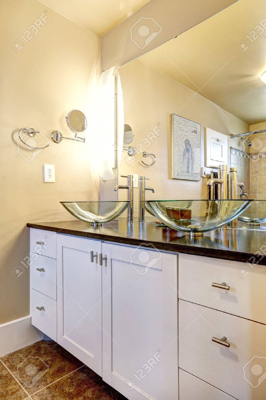 White Bathroom Vanity Cabinet With Glass Vessel Sinks And Mirror