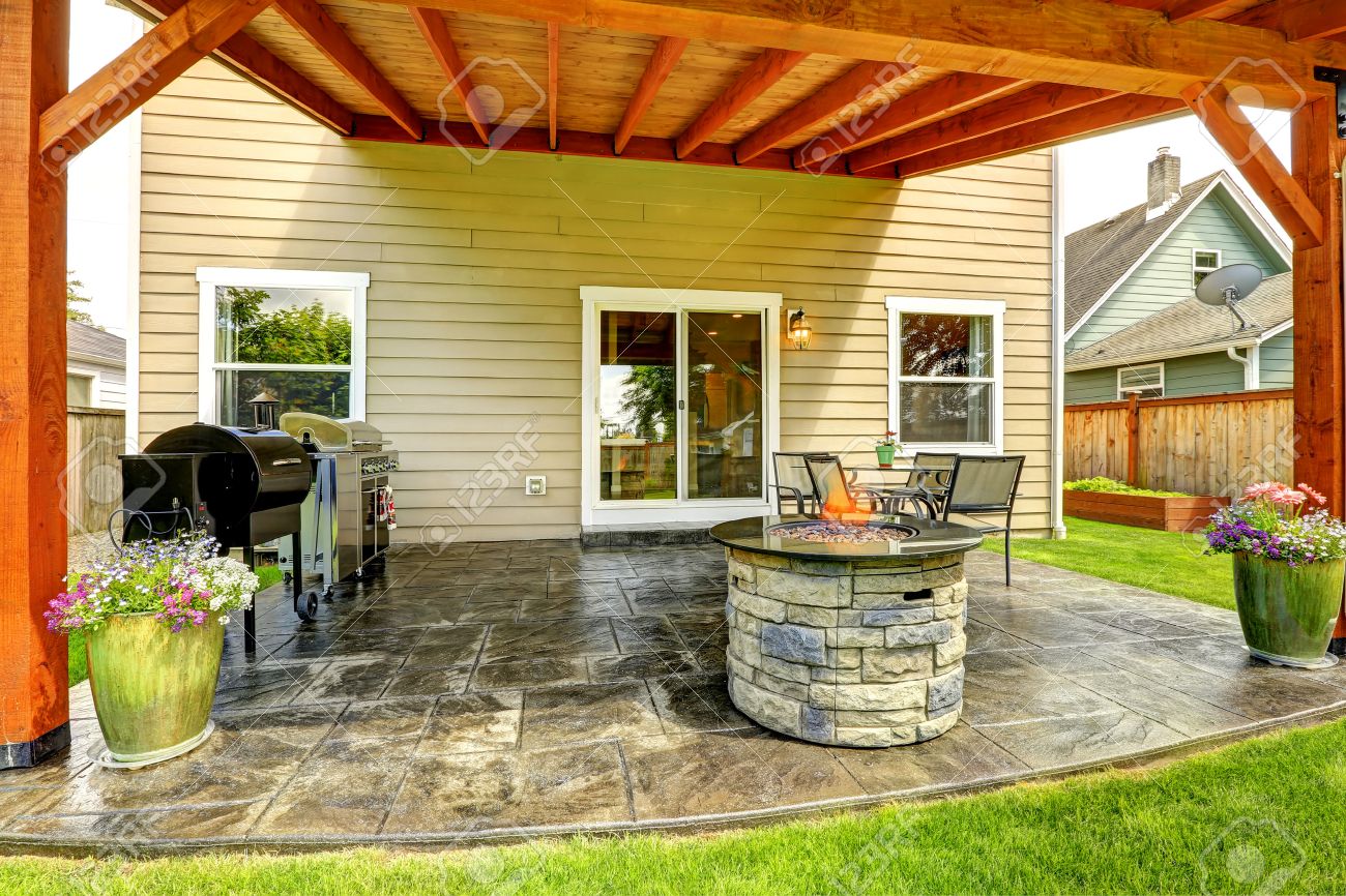 patio table flower pots rattan pergola with patio area tile floor decorated flower pots stone trimmed fire pit with patio area floor decorated flower pots patio table flower pots rattan pergola with patio area tile floor decorated flower pots stone trimmed fire pit with patio area floor decorated flower pots
